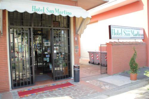 a store front of a store with glass doors at Nuovo Hotel San Martino snc in Casalecchio di Reno