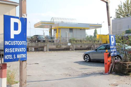 a car parked in a parking lot at a gas station at Nuovo Hotel San Martino snc in Casalecchio di Reno