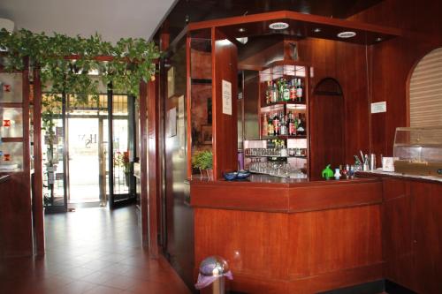 a bar in a restaurant with a counter at Nuovo Hotel San Martino in Casalecchio di Reno