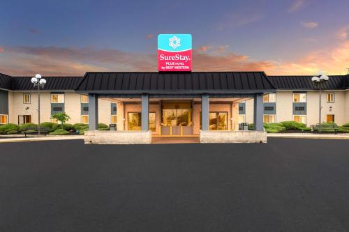 a rendering of the front of a hotel at SureStay Plus Hotel by Best Western McGuire AFB Jackson in Cookstown