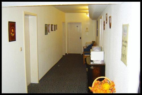 an office hallway with a hallway leading to at Hotel & Restaurant Raisch in Steinwenden
