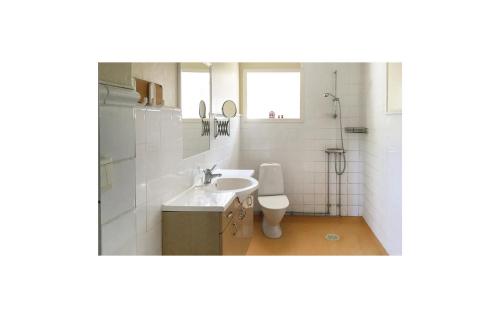 a bathroom with a sink and a toilet at Nice Home In Dals Lnged With 2 Bedrooms in Dals Långed