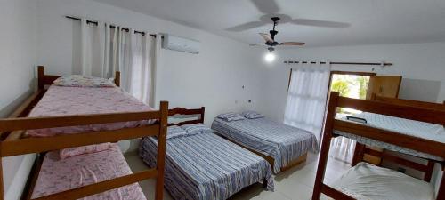 Una cama o camas en una habitación de Pousada Familiar Morada do Rapha