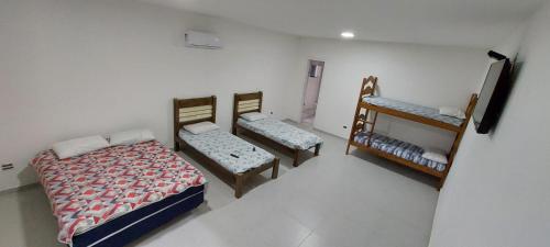 Una cama o camas en una habitación de Pousada Familiar Morada do Rapha
