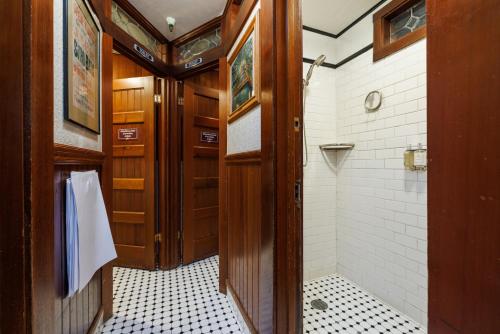 a bathroom with a walk in shower and a walk in shower at San Remo Hotel in San Francisco