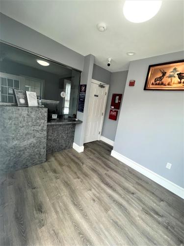 a room with a counter and a large wall at Shangri-La Motel in Seekonk