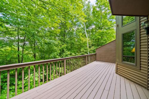 a large wooden deck on the side of a house at Gore Village Townhome #16 in North Creek