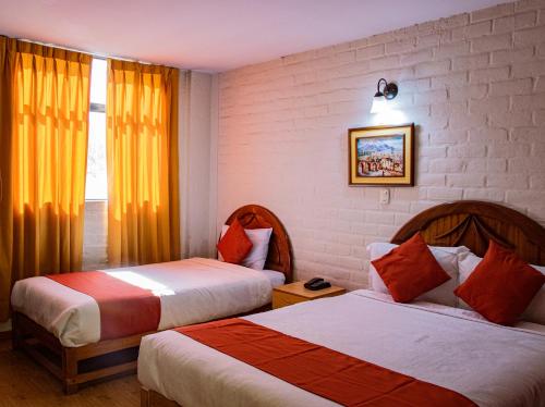 Tempat tidur dalam kamar di Hotel La Posada de Ugarte