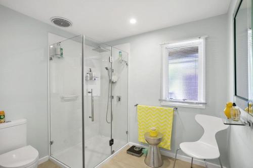 a bathroom with a shower and a toilet and a sink at Cosy Corner - BYO Linen in Torquay