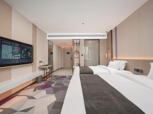 Postel nebo postele na pokoji v ubytování Lavande Hotel Qihe Economic Development Zone