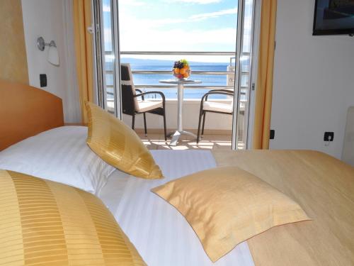 Ένα ή περισσότερα κρεβάτια σε δωμάτιο στο Hotel Sunce