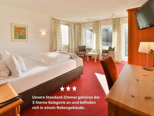 Ένα ή περισσότερα κρεβάτια σε δωμάτιο στο Hotel Antoniushütte