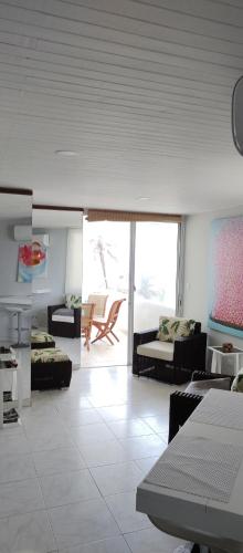 a living room with a couch and a table at Vista Playa in Cartagena de Indias