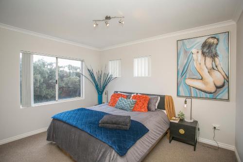 a bedroom with a bed and a large window at "WATERLILY HOUSE" - Luxury Canal House, Jetty, Dog & Child Friendly - Sleeps 14 in Mandurah
