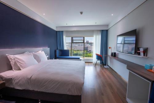 Katil atau katil-katil dalam bilik di Holiday Inn Express Hengshui Railway Station by IHG