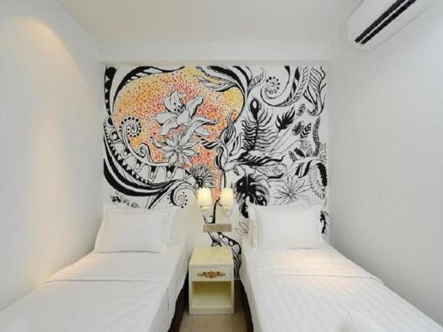 Ένα ή περισσότερα κρεβάτια σε δωμάτιο στο Hotel de Art USJ 21