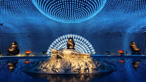 a buddha statue in a room with blue lights at Holiday Inn - Nanjing South Station by IHG in Nanjing