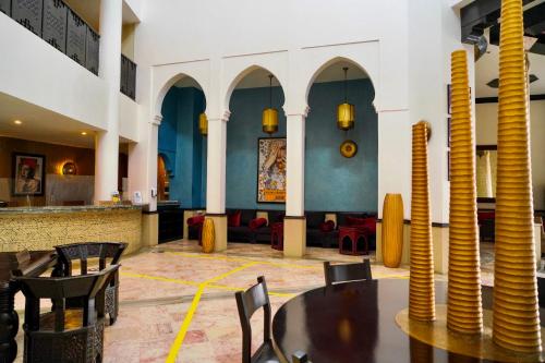 a large room with a large clock on the wall at Odyssee Park Hotel in Agadir