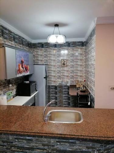 a kitchen with a sink and a counter top at Sea spirit in Alexandria
