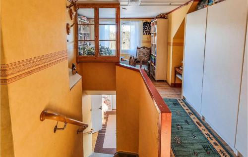 a hallway with a staircase in a house at 3 Bedroom Gorgeous Home In Älvsered in Älvsered