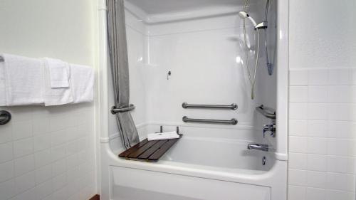 a bathroom with a shower and a bath tub at Motel 6-Springfield, IL I-55 I-72 in Springfield