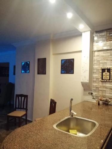 a kitchen with a sink and a counter top at Sea spirit in Alexandria