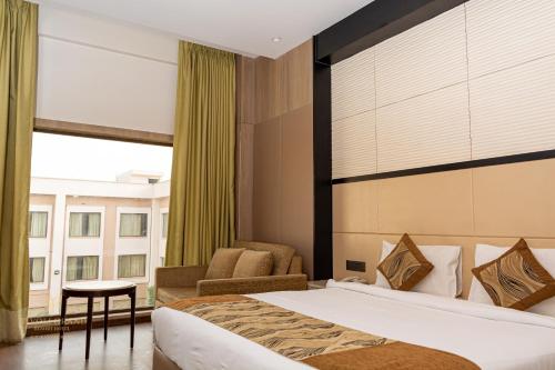 Cama ou camas em um quarto em Tivoli Grand Resort