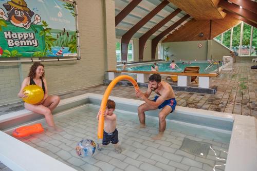 a group of people playing in a swimming pool at Vallée Les Etoiles in Blaimont
