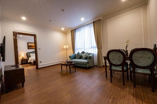 a living room with a couch and a table at MADELISE HOTEL&APARTMENT in Hai Phong