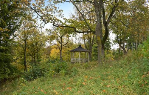 a gazebo in the middle of a field with trees at Nice Apartment In Tranås in Tranås