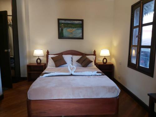 מיטה או מיטות בחדר ב-Mali House