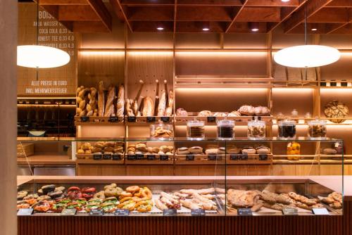 a bakery with many different types of bread and pastries at Karl August - a Neighborhood Hotel in Nürnberg