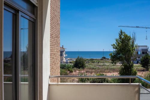 a balcony with a view of the ocean at Foz Village Beach by Rent4All in Buarcos