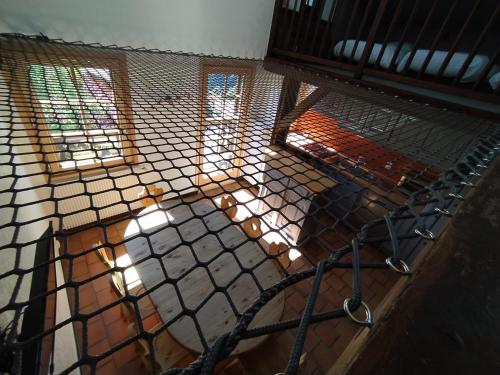 an inside view of a bird cage with windows at Chalet Appart'Hôtel l'Eau Vive in Saint-Nicolas-la-Chapelle