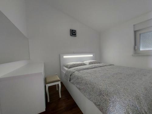 Postel nebo postele na pokoji v ubytování Luxury Apartments Jukić