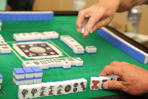 a person playing a game of poker on a table at Kur and Hotel Shinshu in Shiojiri