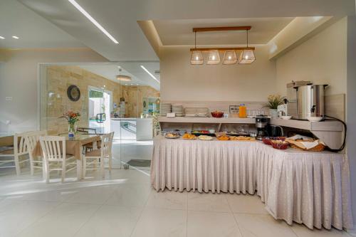 a kitchen with a table with food on it at Troulis Seaside in Amoudara Herakliou