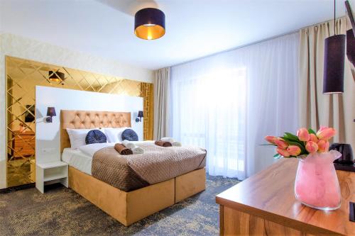 Ένα ή περισσότερα κρεβάτια σε δωμάτιο στο Amber Park Spa