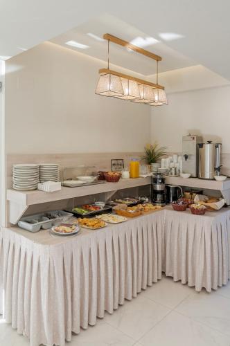 a buffet in a restaurant with food on tables at Troulis Seaside in Amoudara Herakliou