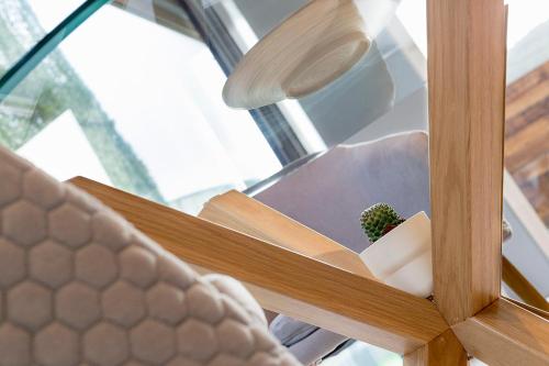 a plant sitting on a shelf next to a window at Luz de Viro in Outes