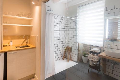 a bathroom with a shower and a sink at Luz de Viro in Outes