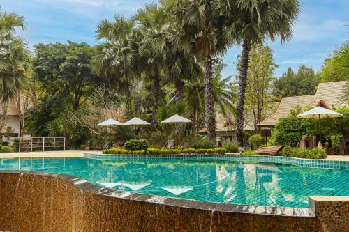 Bazén v ubytování The Legend Chiang Rai Boutique River Resort & Spa - SHA Extra Plus nebo v jeho okolí