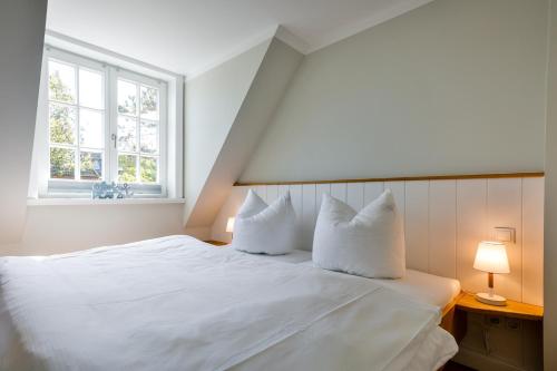 Postel nebo postele na pokoji v ubytování Haus Senwai Hausteil 1
