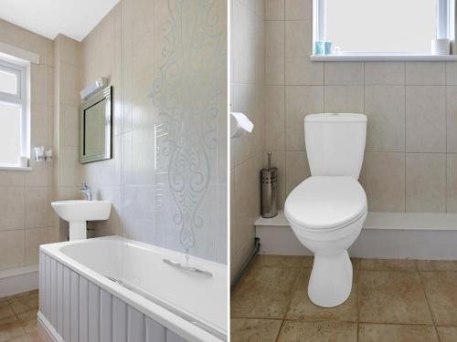 a bathroom with a toilet and a tub and a sink at Dryfesdale Hotel - BW Signature Collection in Lockerbie