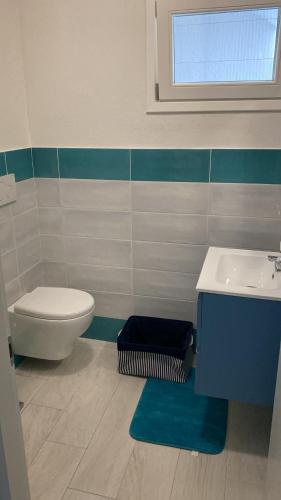 a bathroom with a toilet and a sink at Aqualife luxury home 4 in Arzachena