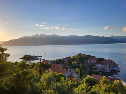 a view of a town on the shore of a body of water at Holiday Home Brinic in Tivat