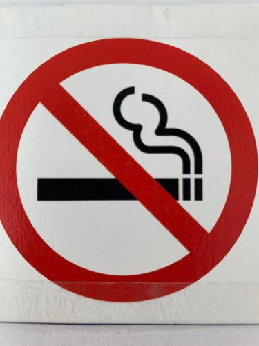 a no smoking sign on a wall at Budget Small Room City Centre in Oslo