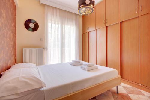 Postel nebo postele na pokoji v ubytování East City Living Apt - Netflix, Vesta Philoxenia