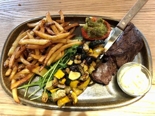 a plate of food with a steak and french fries at Eklo Toulouse in Toulouse