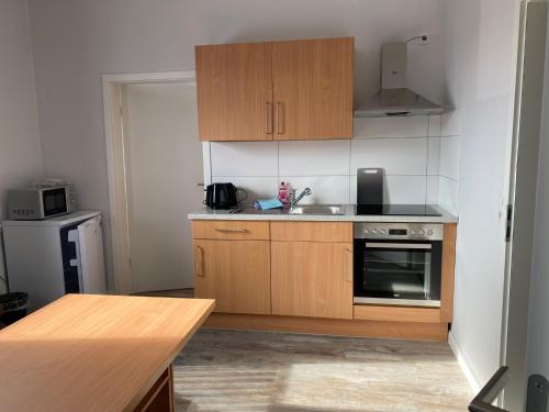 Η κουζίνα ή μικρή κουζίνα στο Tempel-inn Appartements Molkereistr. 2